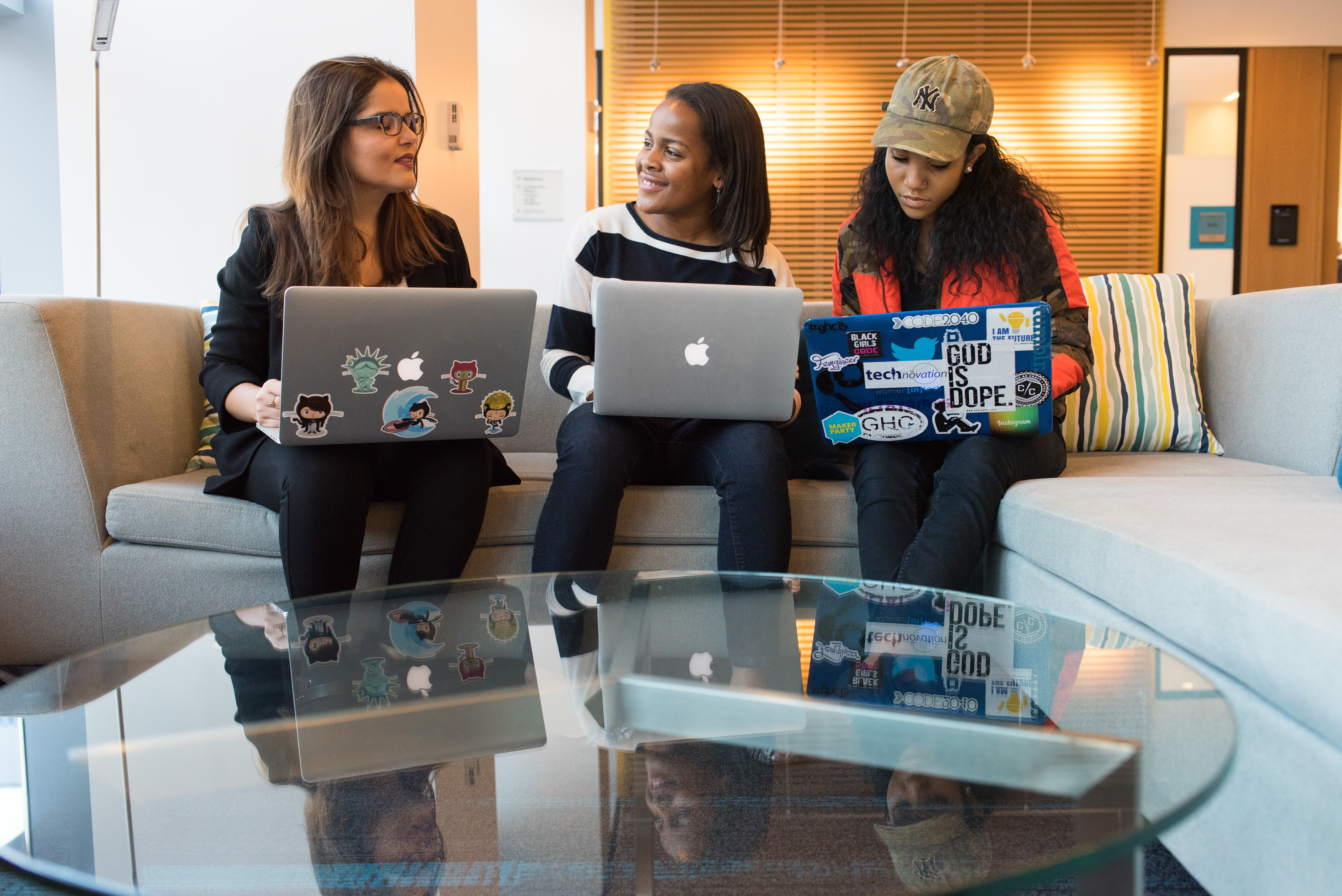 Diverse Small Group of Women Chatting with Laptops