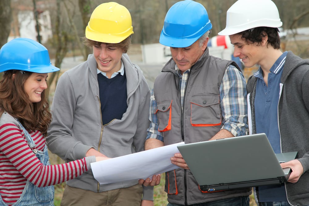 Adult with group of teenagers in professional training