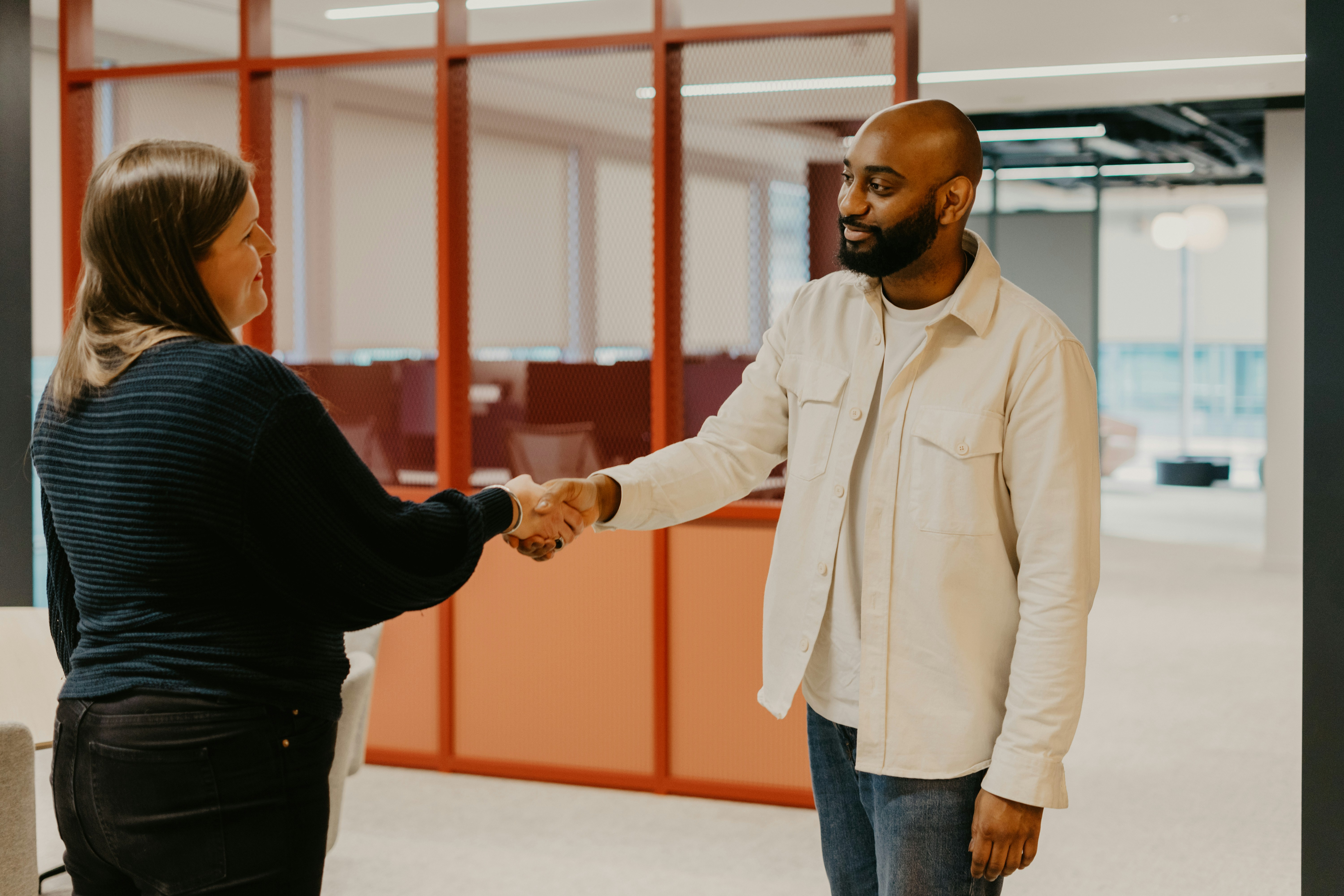 How hiring assessment tools make for a better candidate experience - interviewer and candidate shaking hands