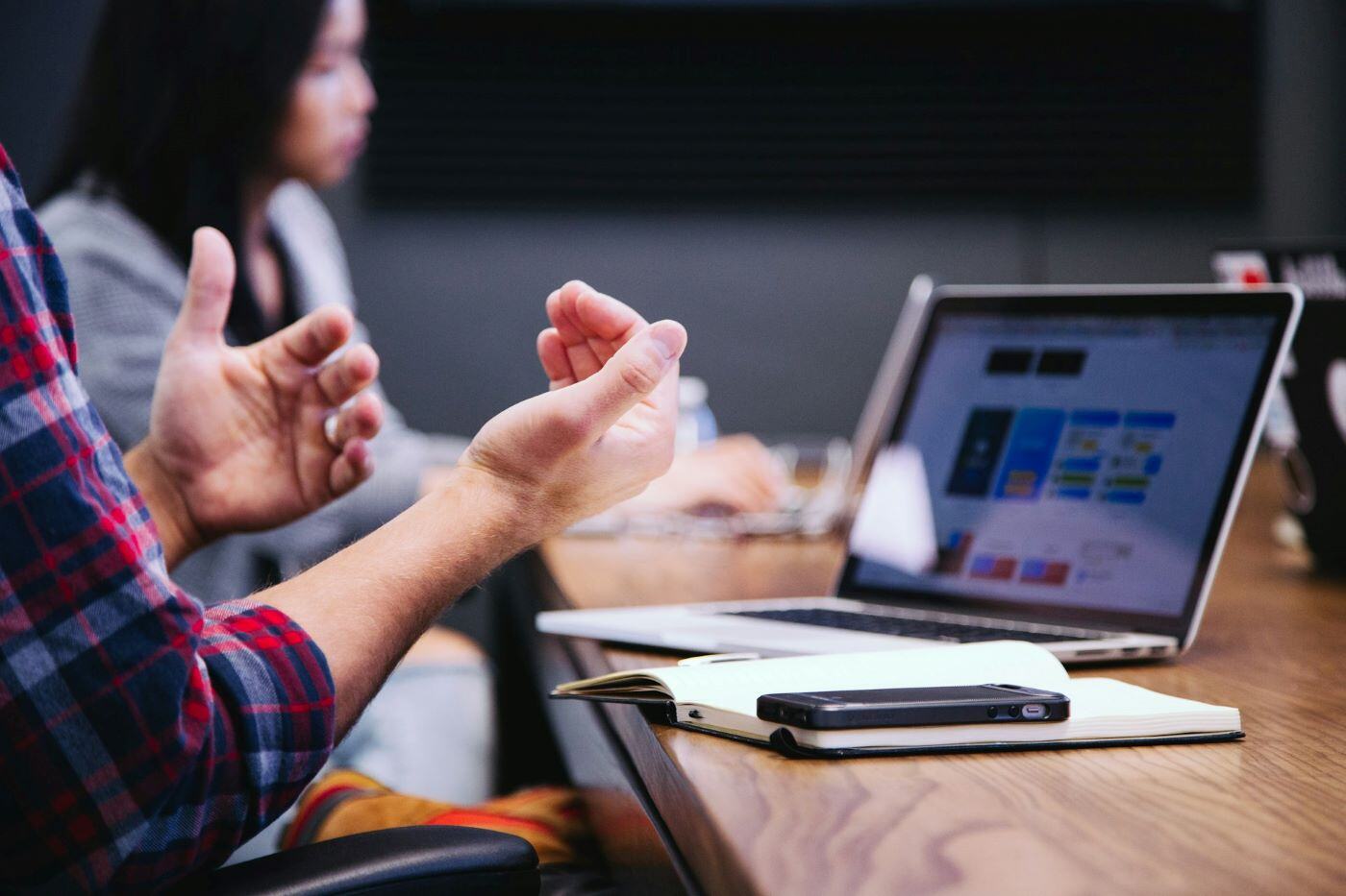 Conference table man talking with hands