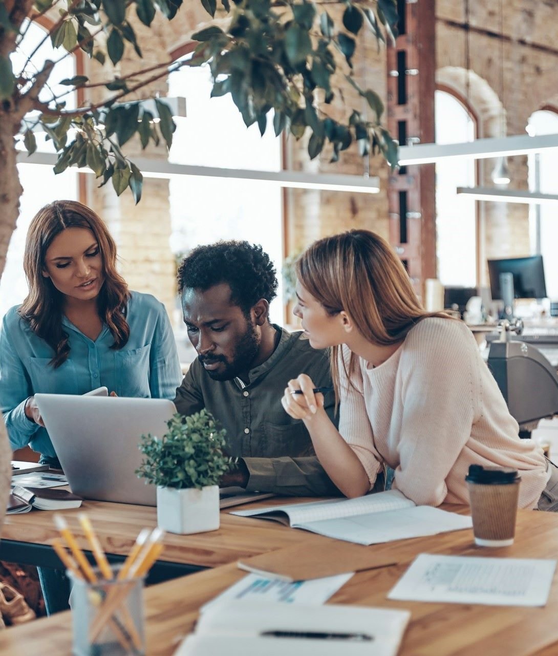Coworkers in office talking