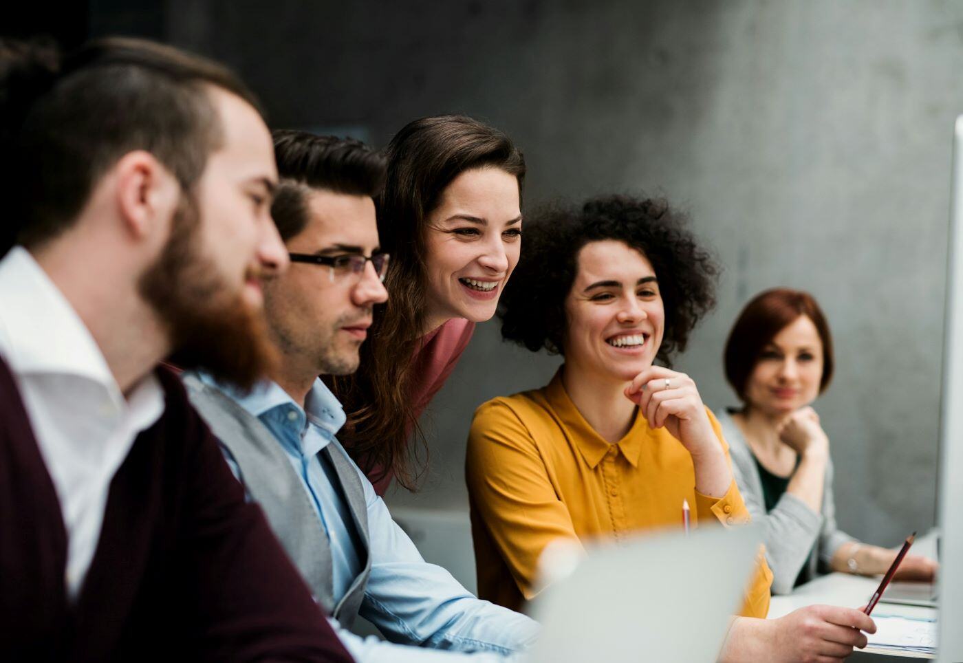 Four employees discussing a project