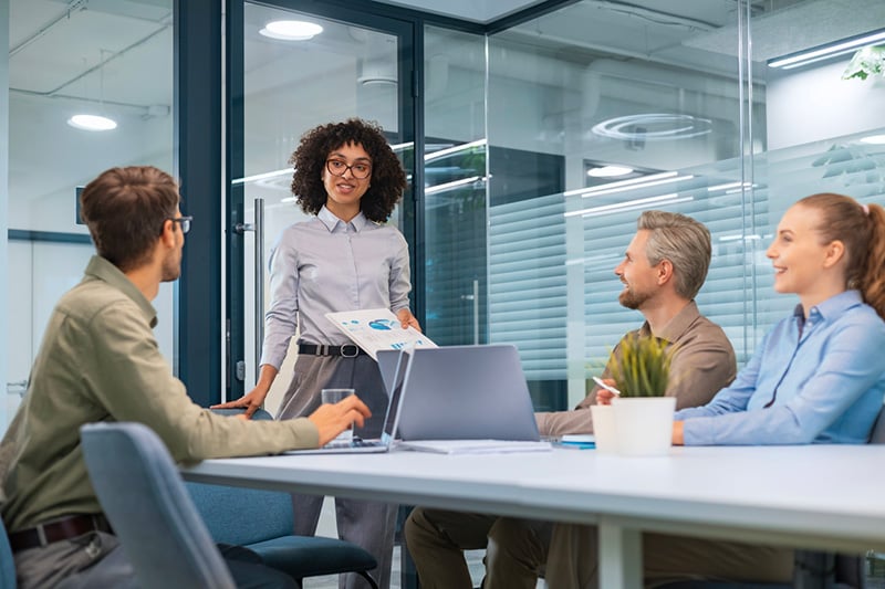 business meeting - manager discussing work with his colleagues