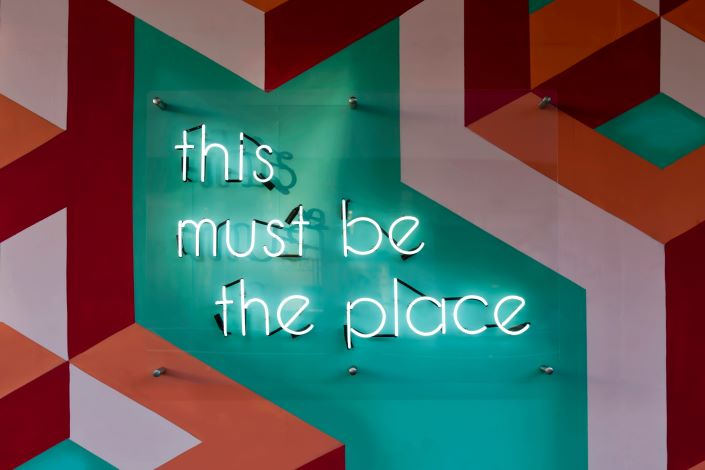 Hiring Assessments - Neon Sign this must be the place
