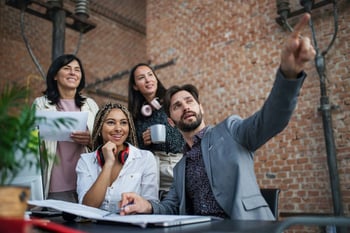 Man pointing in office setting