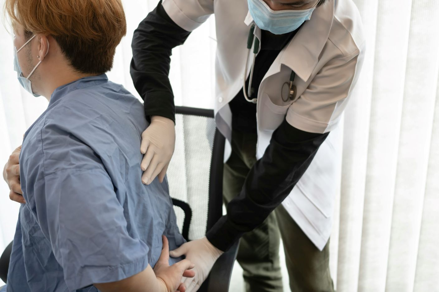 Medical professional with patient