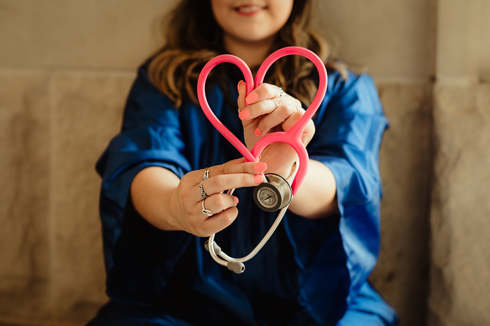 Nurse making heart with stethoscope