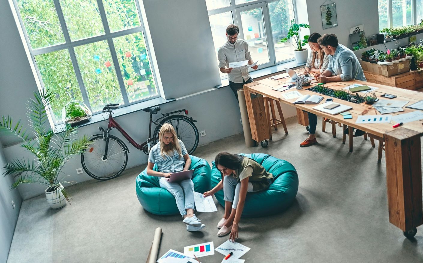 Office with employees sitting in bean bags