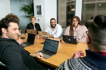 People sitting around a table in the office