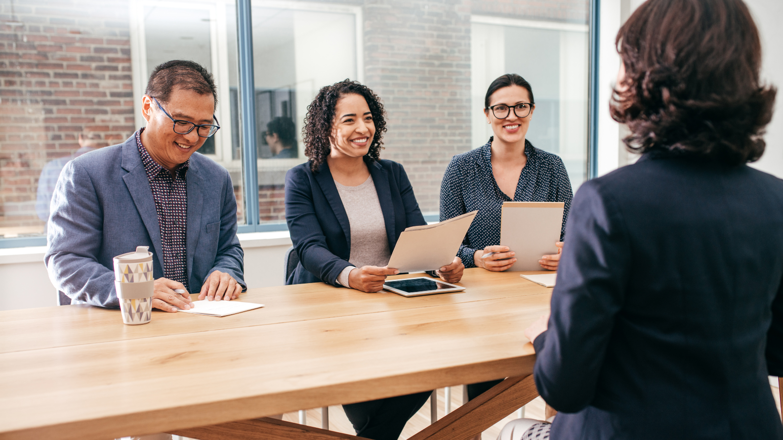 Female job candidate in friendly panel interview