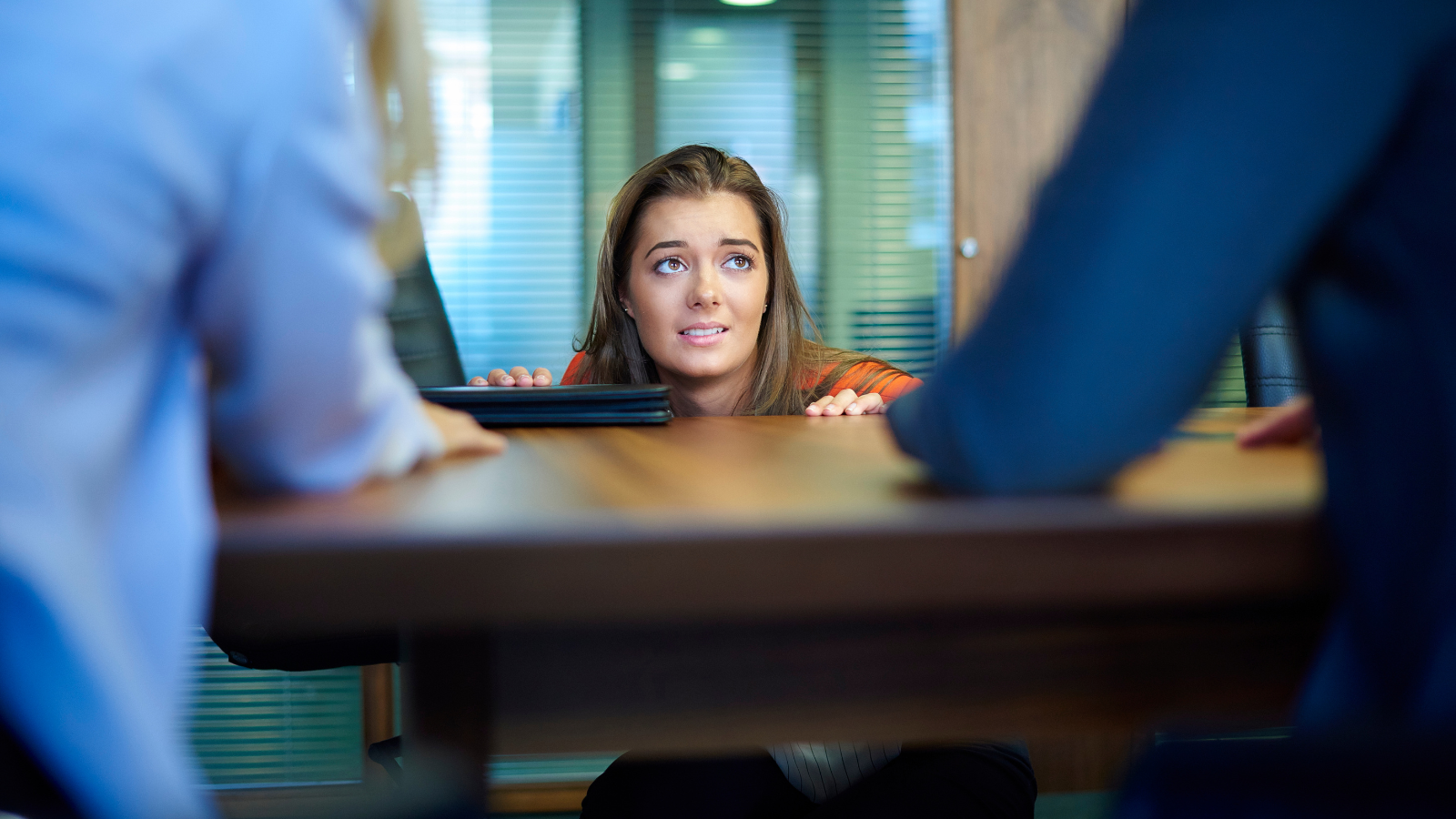 Female job candidate in intimidating interview