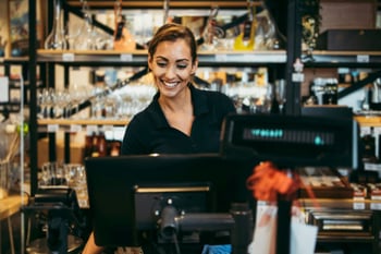 Woman working at cash register