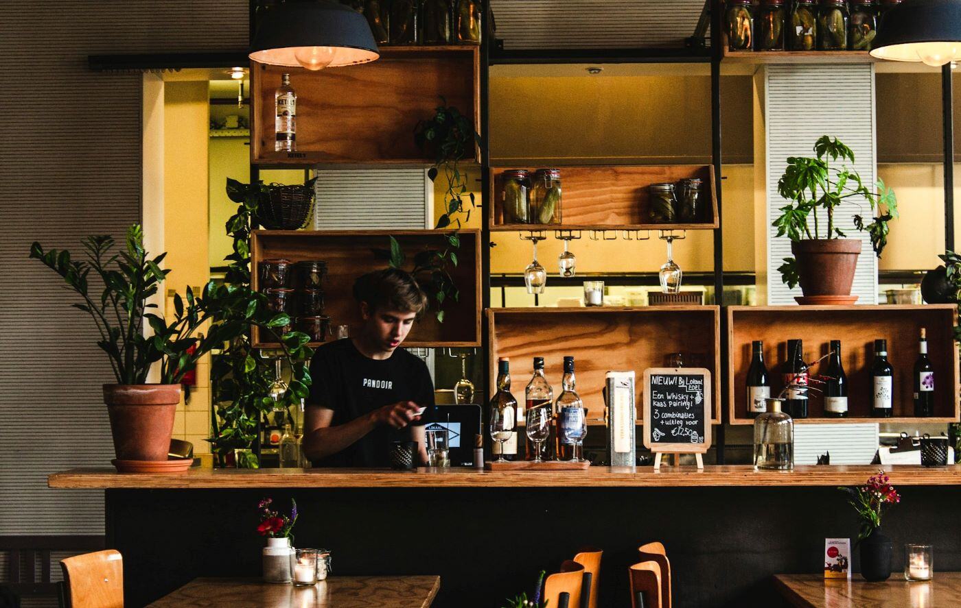 Young service work behind bar