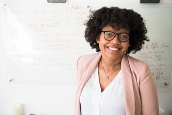 Professional female in front of whiteboard