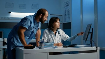 healthcare communication, team members reviewing information on a screen